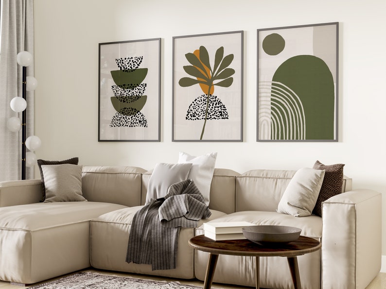 May include: Three framed abstract art prints with a green, brown, and white color scheme. The prints feature geometric shapes and patterns.