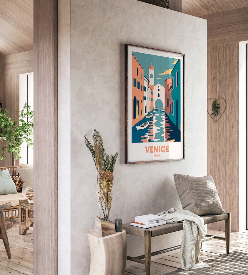 May include: A colorful illustration of a canal in Venice, Italy. The image features buildings with orange, pink, and blue facades, and boats on the water. The text "VENICE ITALY" is printed below the image.