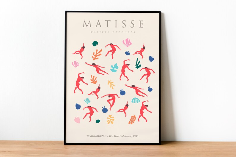 Puede incluir: Un p&oacute;ster enmarcado en negro con el texto "MATISSE PAPIERS DECOUPES" en blanco. El p&oacute;ster presenta un dise&ntilde;o abstracto colorido de figuras rojas y formas sobre un fondo crema. El texto "BERGGRUEN & CIE - Henri Matisse, 1953" est&aacute; en la parte inferior del p&oacute;ster.