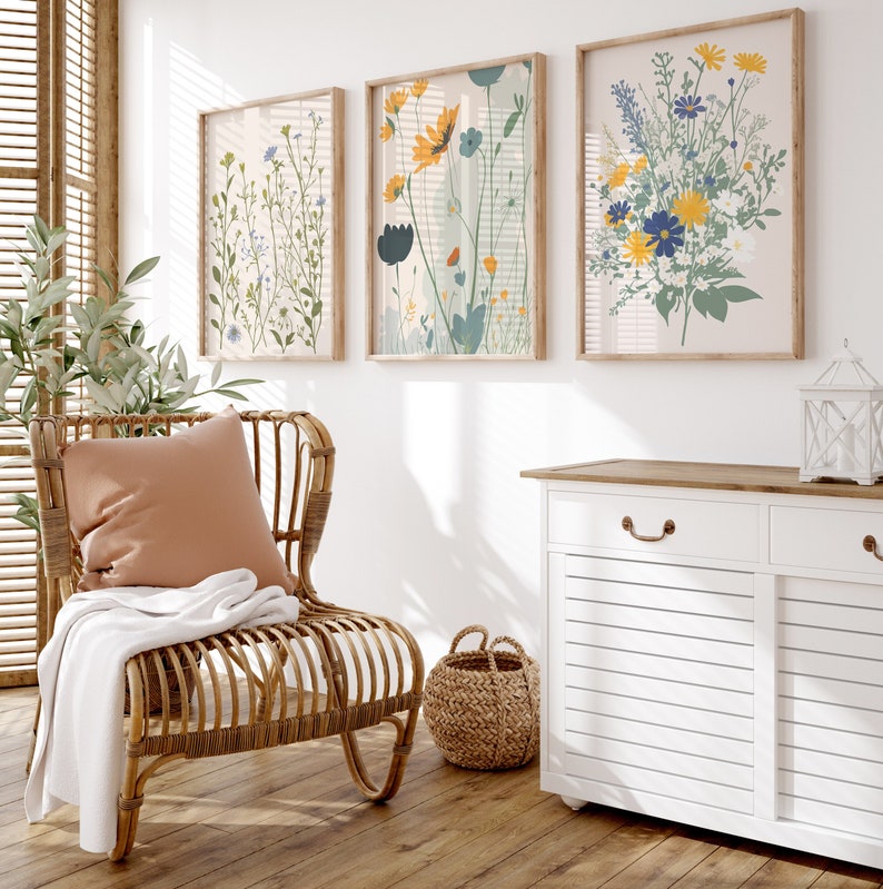 Set of three botanical wildflower prints with yellow, blue, and green meadow flowers for cottagecore or nature-inspired home decor.