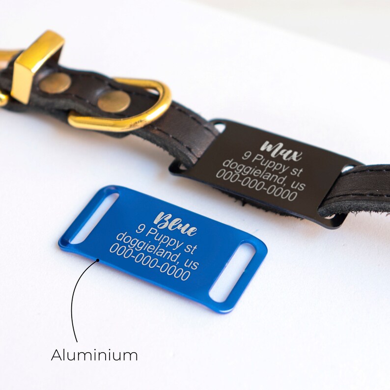 May include: Two personalized dog tags, one black and one blue, with engraved text. The black tag reads "Max 9 Puppy st doggieland, us 000-000-0000". The blue tag reads "Blue 9 Puppy st doggieland, us 000-000-0000". The tags are made of aluminum.
