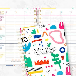 May include: A spiral-bound planner with a white cover featuring colorful abstract shapes and the text Montse agenda escolar. The open planner pages display a weekly schedule in Spanish with days of the week from Monday to Friday in a grid layout.