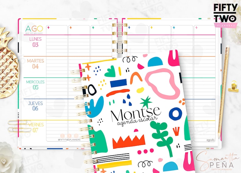 May include: A spiral-bound planner with a white cover featuring colorful abstract shapes and the text Montse agenda escolar. The open planner pages display a weekly schedule in Spanish with days of the week from Monday to Friday in a grid layout.