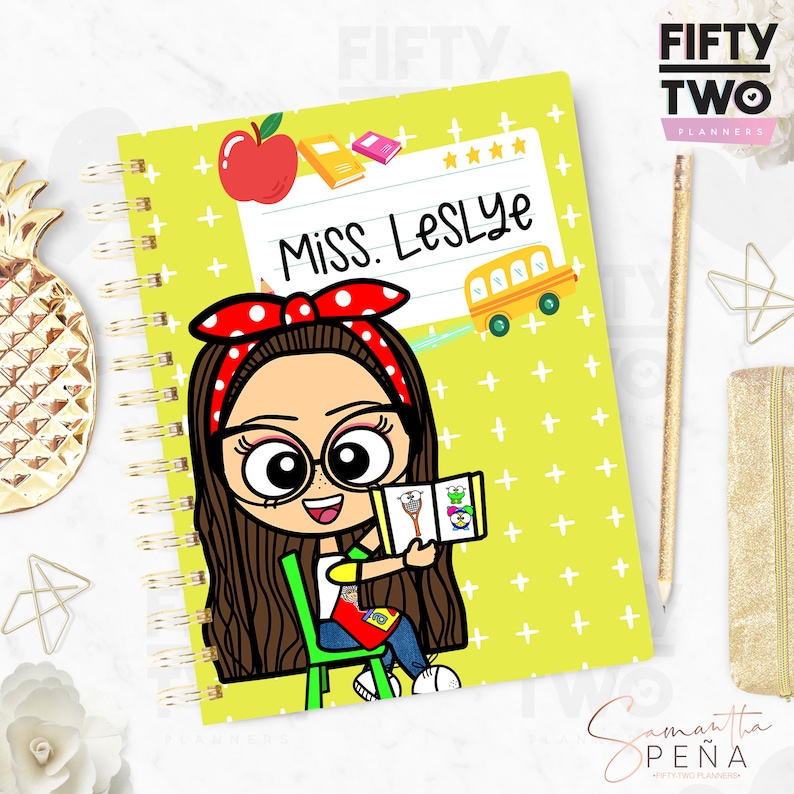 May include: A spiral-bound planner with a cartoon illustration of a teacher holding a book. The cover is lime green with white plus signs and the text "Miss LesLYe". A red apple, books, and a yellow school bus are also featured.