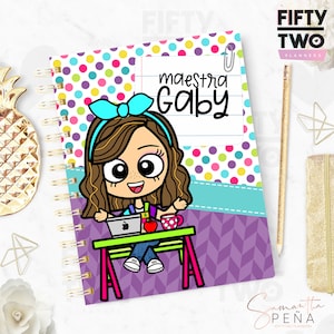 May include: Spiral-bound planner with a colorful polka dot and chevron design. The cover features a cartoon illustration of a teacher with the text "maestra Gaby". Includes a pencil and gold-colored accessories.
