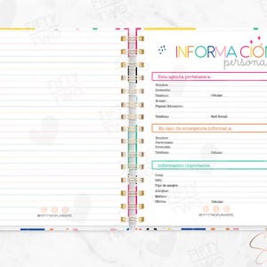 May include: An open spiral-bound planner with a lined left page and a right page titled Informacion Personal. The right page features sections for personal details, emergency contacts, and medical information with colorful headers.