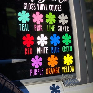 May include: A decal sheet with a variety of colors, including teal, pink, lime, silver, red, white, blue, green, purple, orange, yellow, and black. The decal sheet is labeled "Sassy Decal Co. Gloss Vinyl Colors".