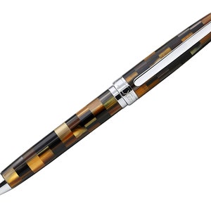 May include: A brown and gold patterned ballpoint pen with a silver clip and cap. The pen has the word "ZEBRA" engraved on the side.