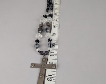 Christian Cross with screw heads on black and white beaded necklace