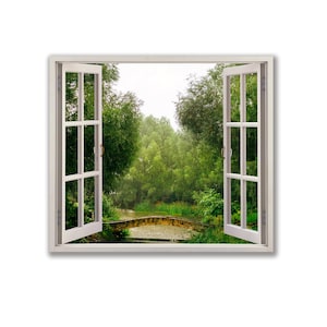 May include: A white window frame with two open windows looking out at a lush green forest with a small stream and a stone bridge.