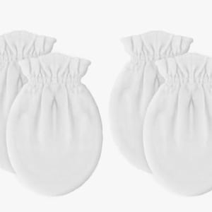 May include: Eight white baby mittens are arranged in pairs. The mittens are made of a soft fabric and have a gathered cuff. The oval-shaped mittens are designed to prevent babies from scratching themselves.