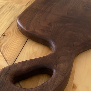 Walnut cutting board with handle