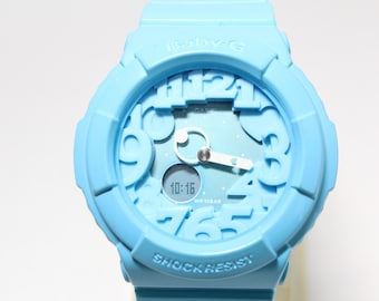 CASIO BGA-130 Montre Baby-G analogique numérique bleu néon avec cadran