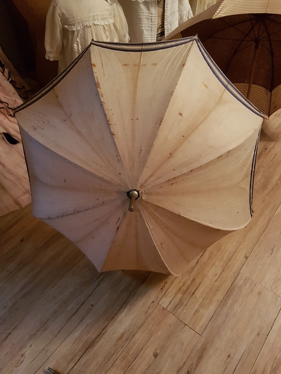 Beautiful old umbrella with wooden handle. Antique