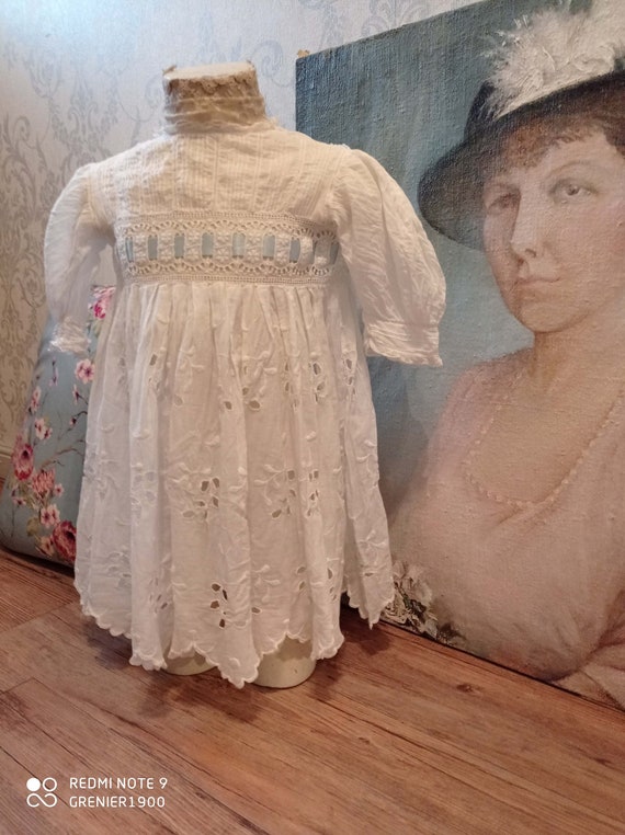 Lovely little old white girl dress and her ribbon.