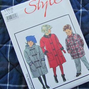 May include: A white sewing pattern envelope labelled Style 1168 size LG featuring illustrations of three coats. One is a grey hooded toggle coat with a blue beret, one is a red coat with dark trim, and one is a red and blue plaid jacket with grey trousers.