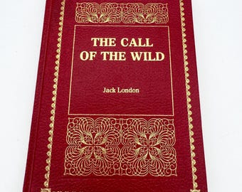 Livro infantil antigo "O Chamado da Selva" de Jack London, capa dura.