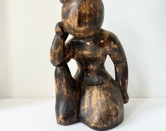 Wooden sculpture, sitting man figurine