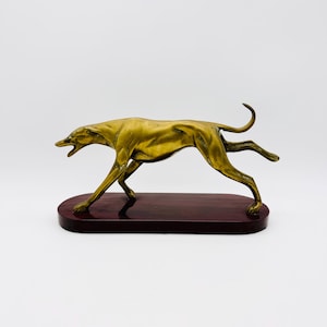 Bounding greyhound brass figure 20th century, brass dog statue