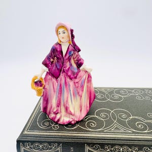 Vintage ceramic lady with basket figure, small ceramic girl figurine