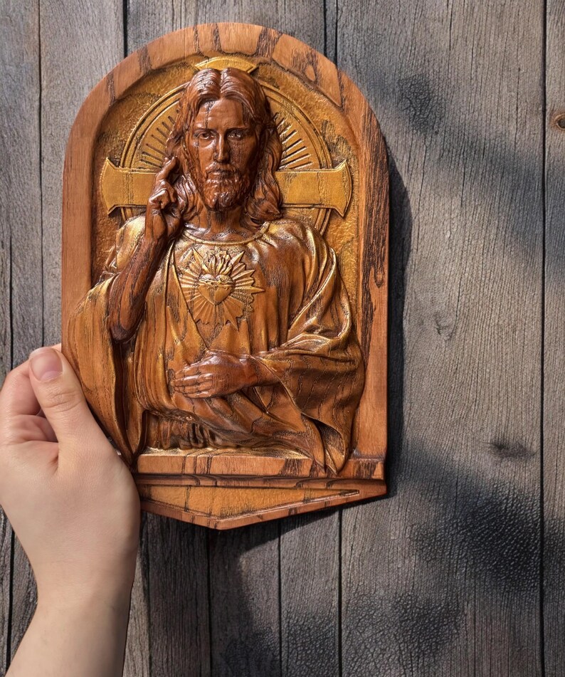 In this photo you can see how the carved plaque looks in your hand. The size on the photo is 10 inches.