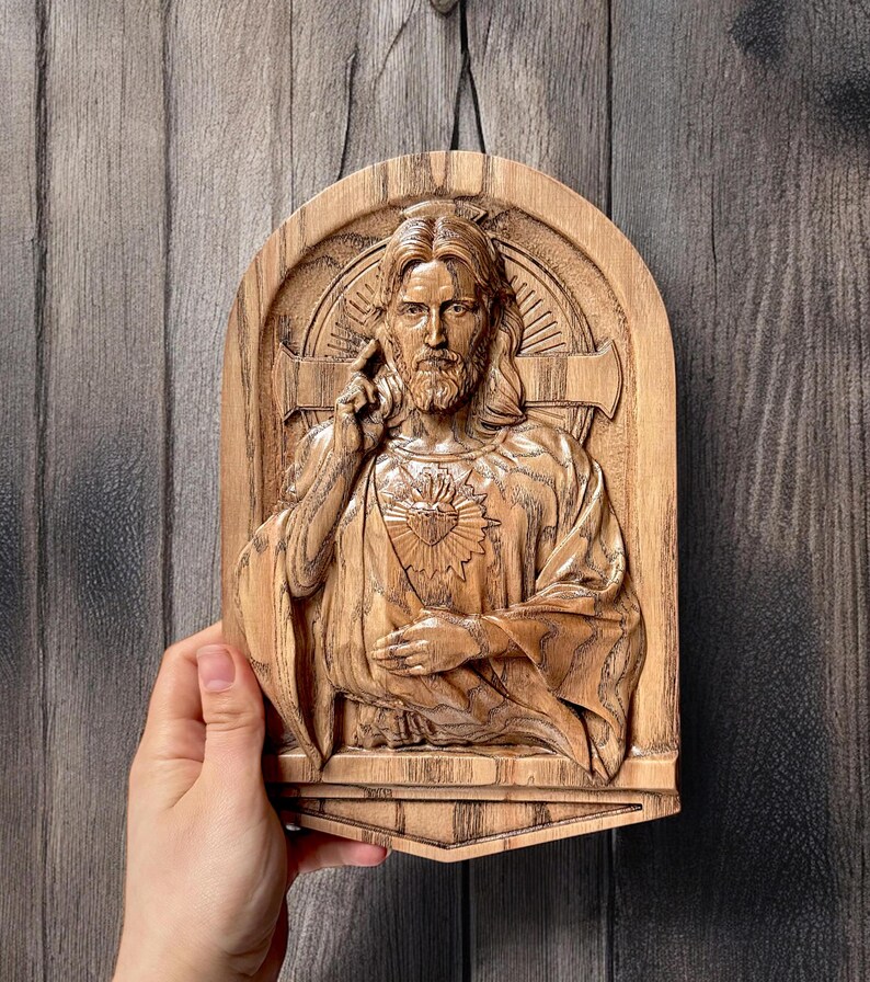 In this photo you can see how the carved plaque looks in your hand. The size on the photo is 10 inches.