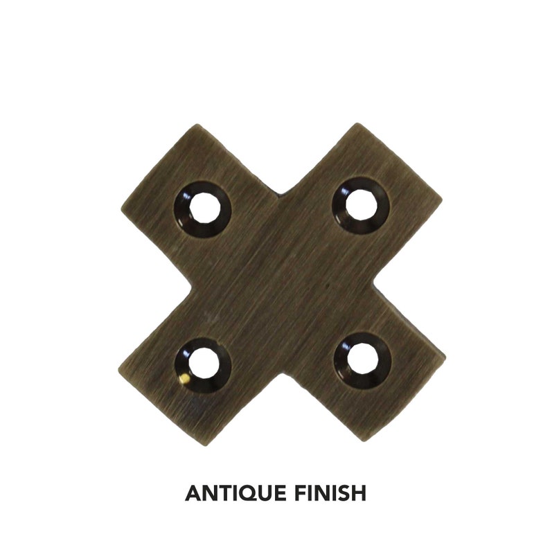 May include: Antique brass corner brace with four holes. The brace is in the shape of an 'X' and has a brushed finish.