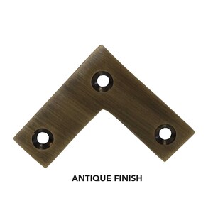 May include: Antique brass corner brace with three holes.  The brace has a brushed finish.