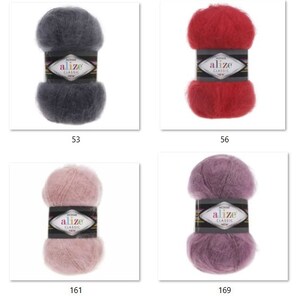 May include: Four skeins of Alize Classic mohair yarn in various colors: dark gray (53), red (56), light pink (161), and purple (169). Each skein is labeled with the Alize brand name and color number. The yarn has a soft, fluffy texture.