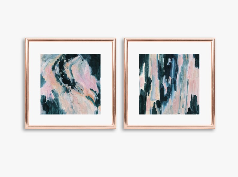May include: Two framed abstract paintings with a teal and pink color scheme. The paintings are in gold frames and are hanging on a white wall.