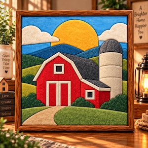 May include: A square framed wall art piece featuring a layered felt-style depiction of a red barn with a white-trimmed door and windows, a tall gray silo, a large yellow sun, white clouds, and rolling green hills under a bright blue sky.
