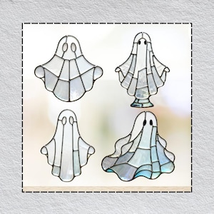 May include: Four stained glass ghost decorations in various shapes. Each ghost is made of white and light blue glass pieces, outlined with dark metal. The ghosts have simple, round eye cutouts. These decorative ghosts are perfect for Halloween.