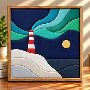 May include: A square framed wall art piece featuring a layered fabric design of a red and white lighthouse on a white shore. Above, abstract teal and green waves flow across a dark blue background, with a solid yellow circle representing the moon.