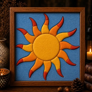 May include: A square framed wall art piece featuring a central yellow sun with radiating curved rays in shades of yellow, orange, and red. The sun is set against a textured blue background, all enclosed within a simple brown wooden frame.