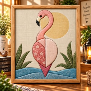 May include: A framed fabric wall art piece featuring a pink flamingo with a floral patterned body, standing in blue water with green foliage. A large yellow sun is in the background. The artwork is set within a light-colored wooden frame.
