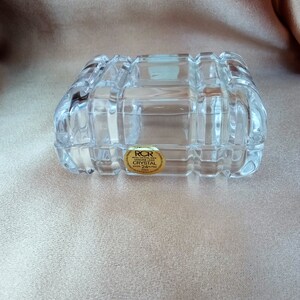 May include: A clear glass box with a gold label that reads "RCR Royal Crystal Rock Genuine Lead Crystal 24% PbO Italy".