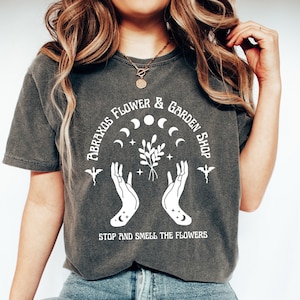 -shirt Couleurs Confort Abraxos Flower & Garden Shoppe | Sarah J Maas sous licence officielle | Les Treize | trône de verre | Manon Bec-noir