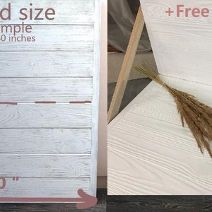 May include: White wood backdrop for photography, folded to 20x40 inches. The backdrop is shown unfolded and set up with a stand, with a dried pampas grass stem on the surface. The text "+Free Mounts" is visible in the image.