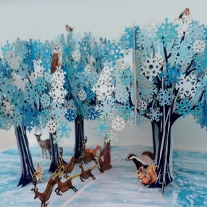 Christmas pop up card with Sleigh and wildlife in forest, Father Christmas, robins, barn owl, deer, reindeer, badger, fox, trees, magical