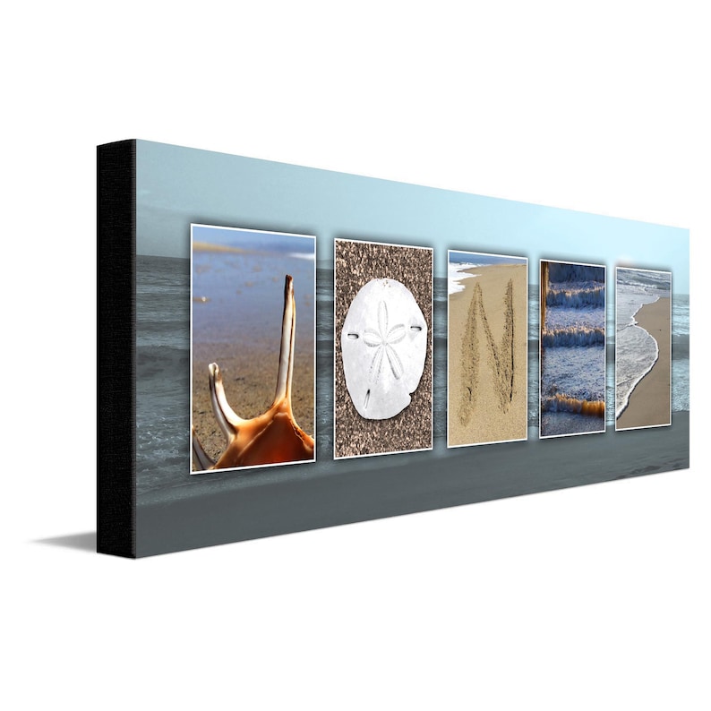 May include: A beach-themed wall art piece with the word "JONI" spelled out using various beach elements. The "J" is a seashell, the "O" is a sand dollar, the "N" is written in the sand, and the "I" is a wave.