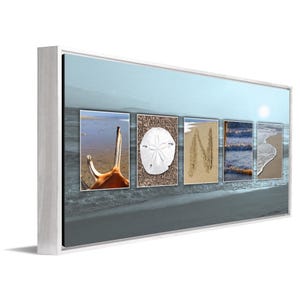 May include: A framed beach-themed wall art piece with the word "JONI" spelled out using various beach elements. The "J" is a seashell, the "O" is a sand dollar, the "N" is written in the sand, and the "I" is a close-up of ocean waves.