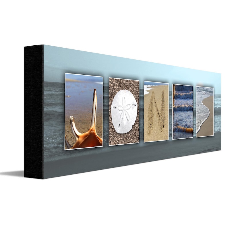 May include: A beach-themed wall art piece with the word "JONI" spelled out using various beach elements. The "J" is a seashell, the "O" is a sand dollar, the "N" is written in the sand, and the "I" is a wave.