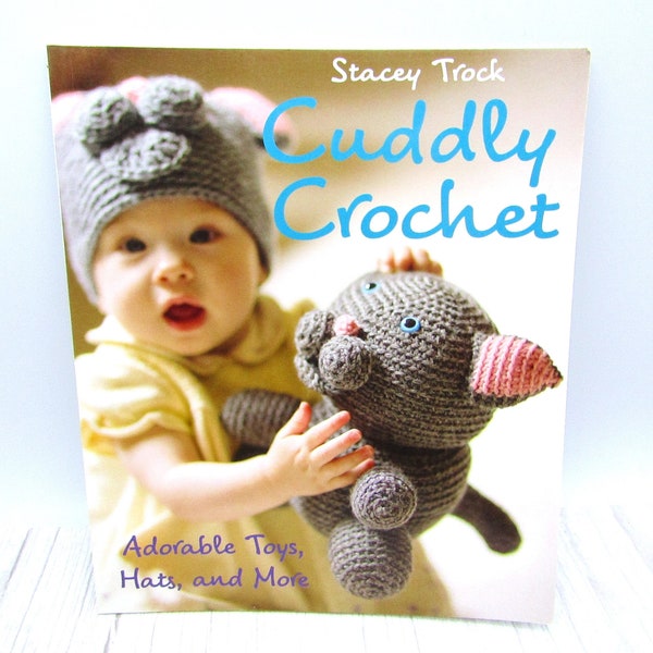 NEW - Cuddly Crochet by Stacey Trock Paperback Crochet Baby pattern book Featuring Adorable Toys Hats and More