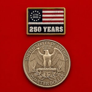 May include: A rectangular gold-toned pin featuring a stylized American flag with the text 1776 2026 and 250 YEARS, positioned above a circular silver-toned United States quarter dollar coin displaying an eagle, the text E PLURIBUS UNUM, and UNITED STATES OF AMERICA.