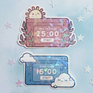 May include: Two holographic stickers with a timer design. The top sticker is pink and features a sun with the text "Time to focus! 25:00 START". The bottom sticker is blue and features a cloud with the text "Break time! 15:00 START".