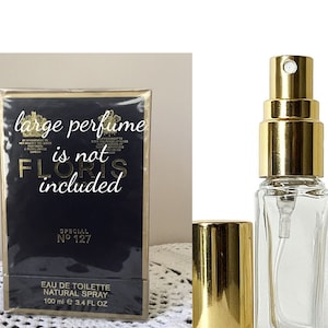 May include: A black and gold box with the text "large perfume is not included" and "Special No 127" on it. The box is for a 3.4 fl oz bottle of Eau de Toilette natural spray.