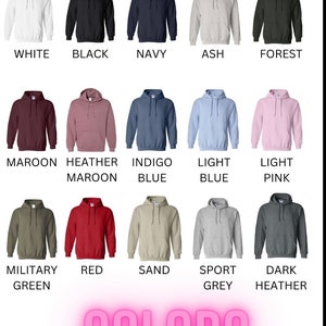 May include: A chart showing 15 different colors of hooded sweatshirts. The colors include white, black, navy, ash, forest, maroon, heather maroon, indigo blue, light blue, light pink, military green, red, sand, sport grey, and dark heather.