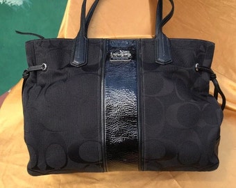 black fabric coach purse