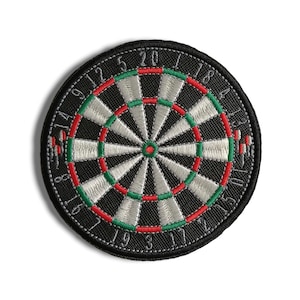May include: A black and white dartboard with red and green accents. The numbers 1 to 20 are printed around the board.