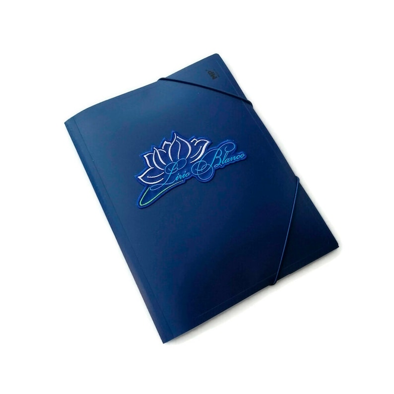 May include: A navy blue document folder with a black elastic band closure. The folder features a logo with a lotus flower and the text "L&iacute;rio Blanco" in white and blue. The folder is on a white background.